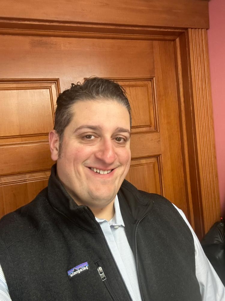 The image shows a gray silhouette of a human figure within a white square background, resembling an avatar commonly used for online profiles.